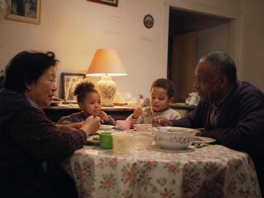 Grandparents sharing a meal with a child